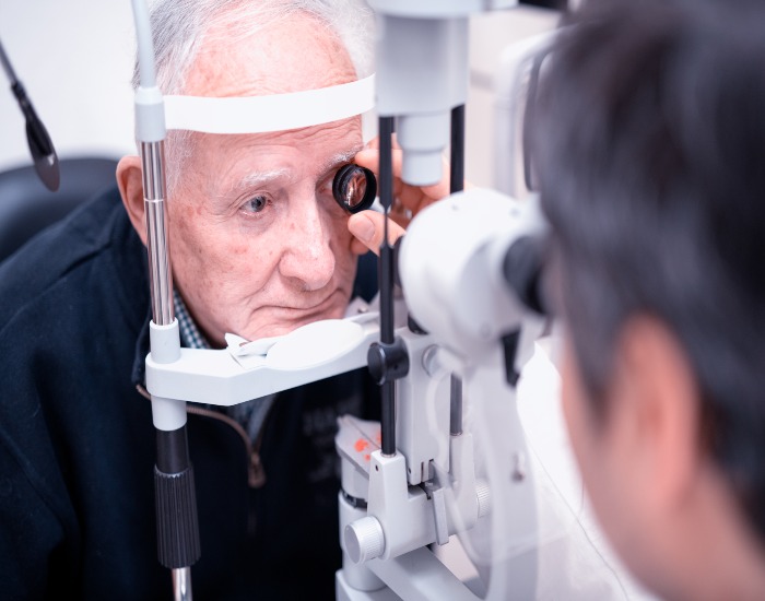 An old man being treated for central retinal vein occlusion at Spindel Eye Associates in Derry, NH