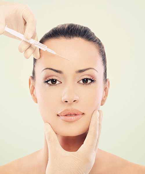 a woman getting botox injection